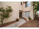 Exterior view showcasing desert-style landscaping and a covered entryway at 8112 Broken Spur Ln, Las Vegas, NV 89131