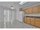 Bright kitchen with tiled floors, wood cabinets, and a sliding glass door at 8112 Broken Spur Ln, Las Vegas, NV 89131