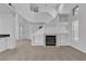 Bright, open living room with a fireplace and neutral carpet flooring at 8112 Broken Spur Ln, Las Vegas, NV 89131