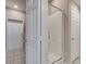 Modern bathroom features shower, tile floors, and entry to other rooms at 8487 Insignia Ave # 105, Las Vegas, NV 89178