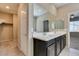 Spacious bathroom features dual sink vanity and is conveniently located near closet and bedroom at 8487 Insignia Ave # 105, Las Vegas, NV 89178
