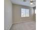 Neutral bedroom with carpet flooring featuring a ceiling fan and good natural light at 8487 Insignia Ave # 105, Las Vegas, NV 89178