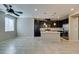 Spacious kitchen featuring dark cabinetry, stainless steel appliances, and a large island with stone countertops at 8487 Insignia Ave # 105, Las Vegas, NV 89178