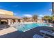Community pool featuring ample lounge chairs at 8487 Insignia Ave # 105, Las Vegas, NV 89178