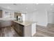 A kitchen island with stainless steel dishwasher, sink and granite countertop at 9068 Kristy Alana St, Las Vegas, NV 89139