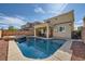 A spacious backyard includes a swimming pool and spa, with a covered patio visible at 996 Cetona Ct, Henderson, NV 89011