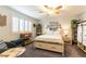 A bedroom features light tones, shutters, ceiling fan, and shelving at 996 Cetona Ct, Henderson, NV 89011