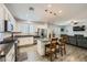 Beautiful kitchen featuring stainless appliances, granite counters, and wood-look flooring at 996 Cetona Ct, Henderson, NV 89011