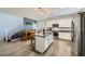 Modern kitchen with a center island, stainless steel appliances, and stylish pendant lighting at 996 Cetona Ct, Henderson, NV 89011