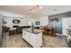 Modern kitchen with a center island, stainless steel appliances, and stylish pendant lighting at 996 Cetona Ct, Henderson, NV 89011