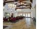 An elegant lobby with high ceilings, beams, and designer lighting plus ample seating areas at 996 Cetona Ct, Henderson, NV 89011