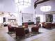 A community lobby features elegant chandeliers, comfortable seating, and decor at 996 Cetona Ct, Henderson, NV 89011