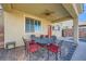 Covered patio with outdoor furniture, a ceiling fan, and a view of the pool at 996 Cetona Ct, Henderson, NV 89011