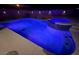 Night view of a private pool with LED lighting and a built-in spa at 996 Cetona Ct, Henderson, NV 89011