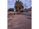 Private backyard featuring desert landscaping and mature palm trees, perfect for relaxing at , Las Vegas, NV 89142