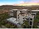 Aerial view of the community showcasing lush landscaping, rooftop patio, and building architecture at 11441 Allerton Park Dr # 212, Las Vegas, NV 89135