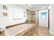 Bright bathroom featuring a soaking tub and walk-in shower at 11441 Allerton Park Dr # 212, Las Vegas, NV 89135