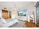 Bright bedroom featuring light gray carpet, white walls, light fixtures, and expansive windows at 11441 Allerton Park Dr # 212, Las Vegas, NV 89135