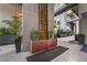 A tranquil courtyard showcasing a decorative water feature surrounded by planters and greenery at 11441 Allerton Park Dr # 212, Las Vegas, NV 89135