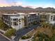 Striking exterior view of modern condos with mountain views and ample parking spaces at 11441 Allerton Park Dr # 212, Las Vegas, NV 89135