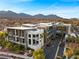 Exterior view of the modern building showcasing its architectural design and surrounding landscaping at 11441 Allerton Park Dr # 212, Las Vegas, NV 89135