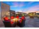 Inviting rooftop area featuring a cozy fire pit and comfortable seating for relaxing evenings at 11441 Allerton Park Dr # 212, Las Vegas, NV 89135