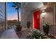 Stylish home featuring a vibrant red front door and modern landscaping at 11441 Allerton Park Dr # 212, Las Vegas, NV 89135