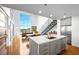 A kitchen and living area featuring an island with a sink, stainless steel appliances, and lots of natural light at 11441 Allerton Park Dr # 212, Las Vegas, NV 89135