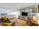 Bright living room featuring a bookshelf and industrial-style ductwork at 11441 Allerton Park Dr # 212, Las Vegas, NV 89135
