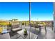 Outdoor patio featuring stylish seating and dining area with picturesque neighborhood views at 11441 Allerton Park Dr # 212, Las Vegas, NV 89135
