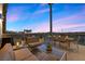 Stylish patio features comfortable seating and an outdoor dining area perfect for entertaining at 11441 Allerton Park Dr # 212, Las Vegas, NV 89135