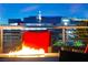 Cozy rooftop fire pit area with comfortable seating and a view of the city skyline at 11441 Allerton Park Dr # 212, Las Vegas, NV 89135