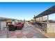 Beautiful rooftop terrace featuring comfortable seating, a built-in bar, and an inviting fireplace at 11441 Allerton Park Dr # 212, Las Vegas, NV 89135