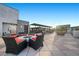 Stylish rooftop terrace with inviting seating, fire pit, and lush potted plants for relaxing or entertaining at 11441 Allerton Park Dr # 212, Las Vegas, NV 89135