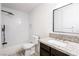 Bathroom with granite counters, a sleek showerhead, and tiled walls at 1405 Vegas Valley Dr # 247, Las Vegas, NV 89169