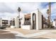Complex exterior featuring multiple units with desert landscaping, balconies, and a red tile roof at 1405 Vegas Valley Dr # 247, Las Vegas, NV 89169