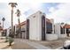 Condo exterior with white facade, dark trim, red tile roof, balcony, and landscaping with desert flora at 1405 Vegas Valley Dr # 247, Las Vegas, NV 89169