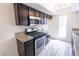 Modern kitchen boasts stainless steel appliances, granite countertops, and ample cabinetry at 1405 Vegas Valley Dr # 247, Las Vegas, NV 89169