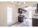 Updated kitchen with granite countertops, stainless steel appliances, and modern fixtures at 1405 Vegas Valley Dr # 247, Las Vegas, NV 89169