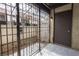 Secured outdoor patio area featuring a security gate and tile flooring at 1405 Vegas Valley Dr # 247, Las Vegas, NV 89169