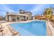 Enjoy the backyard in this desert home with its sparkling pool and mature landscaping at 1812 Renada Cir, North Las Vegas, NV 89030