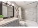 Renovated bathroom boasts new fixtures, stylish tiling, and a modern vanity at 1812 Renada Cir, North Las Vegas, NV 89030