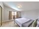 Bedroom featuring neutral tones, large window, and mirrored closet at 1812 Renada Cir, North Las Vegas, NV 89030