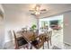 Bright dining room featuring hardwood floors, ceiling fan, and access to the game room at 1812 Renada Cir, North Las Vegas, NV 89030