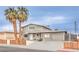 Two story home with a long driveway and decorative front yard at 1812 Renada Cir, North Las Vegas, NV 89030
