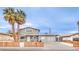 Charming two-story home with a freshly sealed driveway, desert landscaping, and curb appeal at 1812 Renada Cir, North Las Vegas, NV 89030