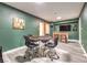 Well decorated game room featuring a poker table, seating, a bar and light grey wood flooring at 1812 Renada Cir, North Las Vegas, NV 89030