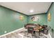 Well decorated game room featuring a poker table, seating, art, and light grey wood flooring at 1812 Renada Cir, North Las Vegas, NV 89030