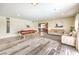 Spacious living room featuring a pool table and a decorative area rug at 1812 Renada Cir, North Las Vegas, NV 89030