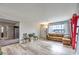 Open-concept living room featuring wood floors and access to other living spaces at 1812 Renada Cir, North Las Vegas, NV 89030